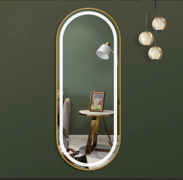 Golden frame oval mirror